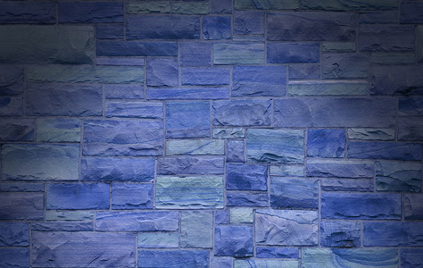 工程地摄影照片_蓝色砖石墙被戏剧性地照亮