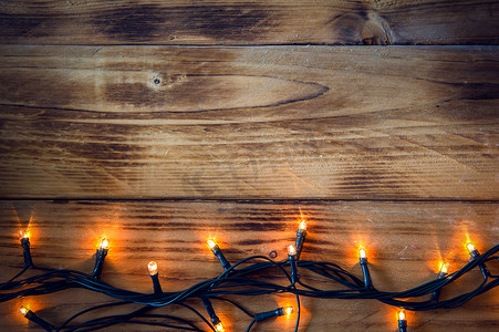 平安夜设计摄影照片_圣诞背景 — 带有灯光和文字的复古木板