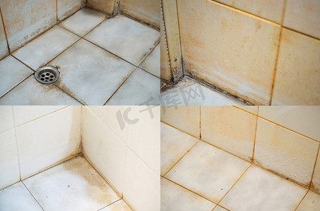 浴室瓷砖的接缝、角落和表面上有污渍。