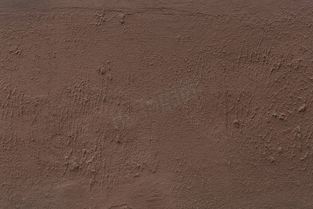 石膏纹理摄影照片_棕色深咖啡色石膏墙抽象粗糙表面粗糙纹理灰泥背景
