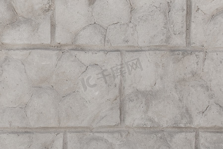 具有裂缝纹理的风化砖旧灰色破墙损坏石背景