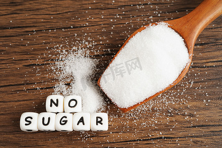 糖尿病前期摄影照片_无糖、甜砂糖与文本、糖尿病预防、饮食和减肥以保持身体健康。