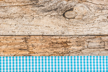 厨房桌面背景摄影照片_复古木桌面背景纹理，带质朴的蓝色桌布