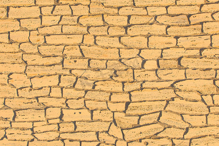 沙色淡黄色旧石砖墙古纹理背景