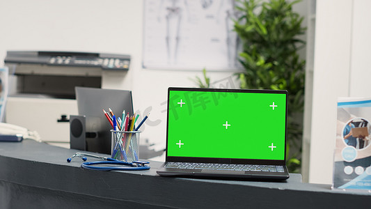 模板医院摄影照片_有空白的绿色屏幕模板的膝上型计算机