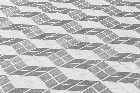 具有抽象几何方形图案铺路板纹理街道城市背景​​的深色和浅色人行道砖