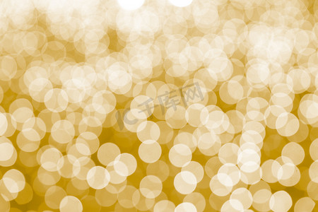 圣诞节圆边框摄影照片_抽象的黄色散景背景。