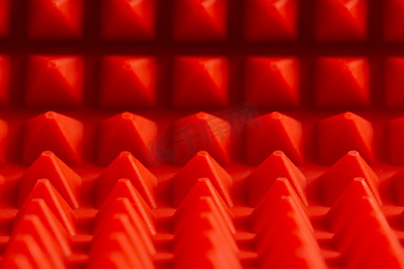 抽象红色硅胶金字塔垫特写背景