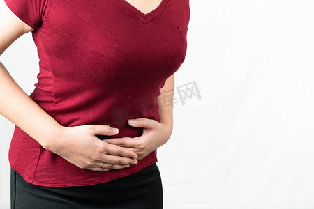 胃胀摄影照片_胃痛，遭受腹痛感觉的少妇