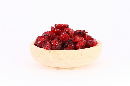 碗红色摄影照片_木碗中的蔓越莓干