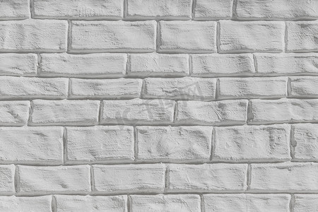 白色砖墙摄影照片_浅灰色或白色砖墙表面纹理背景