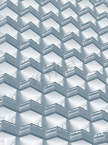 双色调摄影照片_带有几何排列阳台的大型住宅高层建筑的抽象蓝色双色调图像