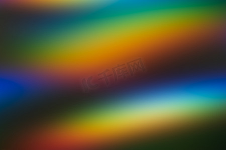 彩虹波浪摄影照片_明亮的彩虹颜色抽象背景。