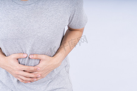 疼痛广告摄影照片_男性触摸急性胃痛在白色背景与副本 s