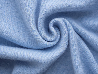 蓝色毛线摄影照片_简约针织蓝色羊绒衫。