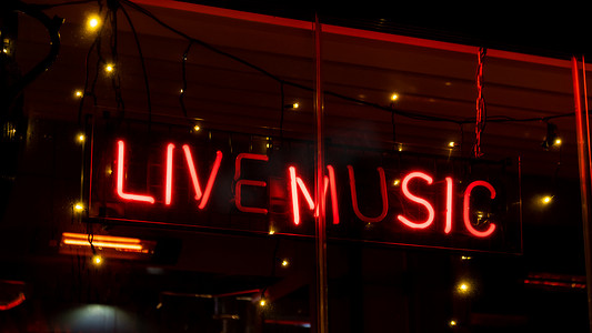 赛博朋克音乐摄影照片_晚上在霓虹灯下现场音乐题词。