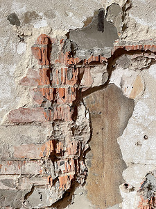 有碎石的破砖墙被遗弃的建筑纹理背景
