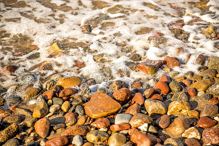 石子摄影照片_巴尔蒂海在鹅卵石上的冲浪