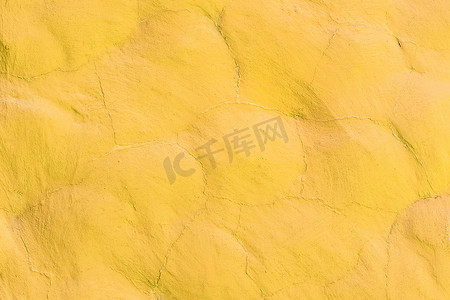 石材表面墙体纹理抽象背景图案设计上的黄色亮光活力涂料