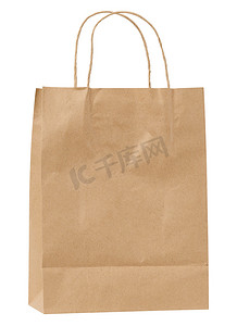 白色背景上带手柄的大型一次性棕色牛皮纸袋，生态包装，零浪费