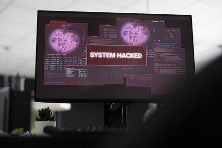 警报消息摄影照片_在屏幕上显示被黑客攻击的系统警报消息的计算机
