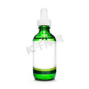 化妆品滴管瓶子摄影照片_带吸管的绿色瓶子。