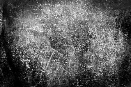 黑白、肮脏的深色纹理，是一堵旧的、划痕的墙，上面有抽象图案、格朗基灰色背景