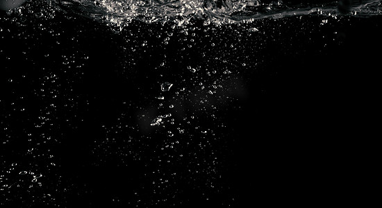 液体飞溅矢量摄影照片_碳酸化液体气泡飞溅的模糊图像