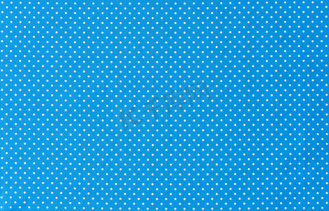 圆点效果图案摄影照片_带白色圆点的蓝色织物背景纹理