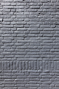 一部分的灰色被绘的砖墙