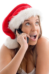 圣诞帽服装摄影照片_戴着圣诞帽打电话的女人