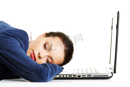 女性疲惫摄影照片_一个疲惫的女商人正在睡觉