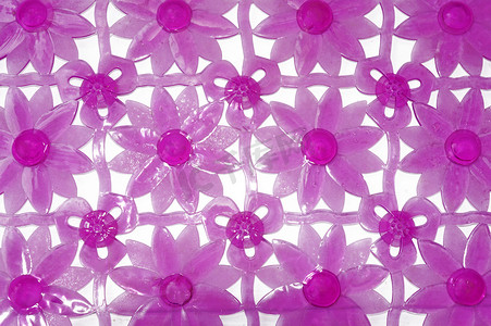 浴室防滑垫摄影照片_以花卉图案为背景的紫色浴缸垫