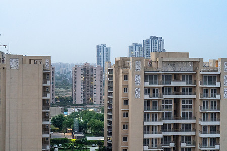 黄昏你摄影照片_建筑物的空中黄昏照片，温暖的橙色灯光照耀着你