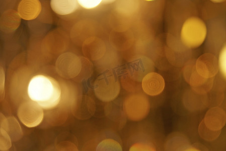 金光点摄影照片_作为抽象背景的散焦金光点