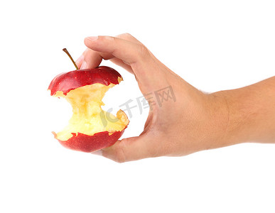 手拿核心摄影照片_手拿着苹果的核心。