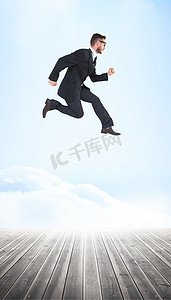 令人讨厌的年轻商人在半空中奔跑的合成图像