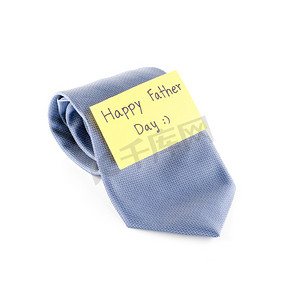 标签背景摄影照片_领带卡标签写父亲节快乐词