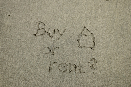 购买或租赁概念，沙滩上的文字，房地产。