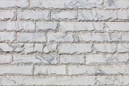 灰色大理石瓷砖的表面，每块瓷砖的周边都有裂痕，有裂缝。