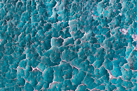 酸性背景蓝色摄影照片_带裂纹的酸性质地