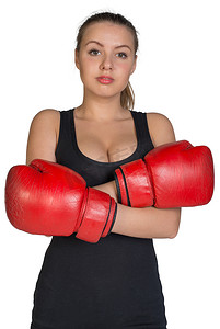 放在胸前摄影照片_双手交叉放在胸前的戴拳击手套的女人
