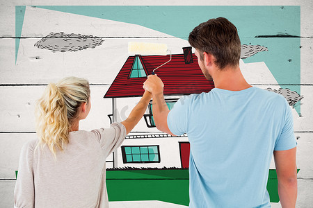 屋顶手绘摄影照片_年轻夫妇用滚筒绘画的合成图像
