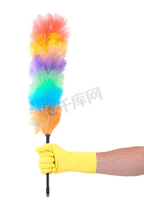 广告黄色摄影照片_戴黄色清洁手套的男人拿着喷粉器