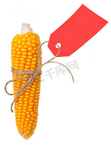 红色穗摄影照片_带有红色价格标签的成熟玉米穗