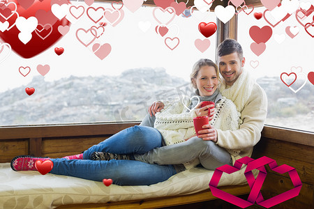 夫妇在冬季穿着咖啡杯靠在机舱窗户上的合成图像
