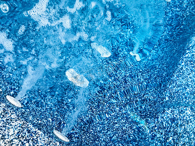 浴缸背景摄影照片_热水浴缸中漩涡气泡的特写