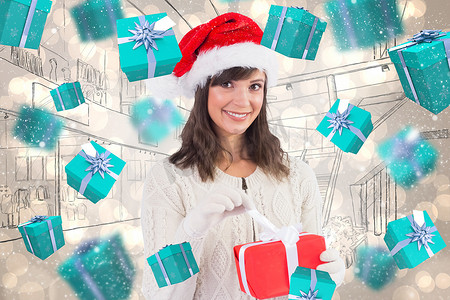 戴着圣诞帽微笑的年轻女子打开礼物的合成图像