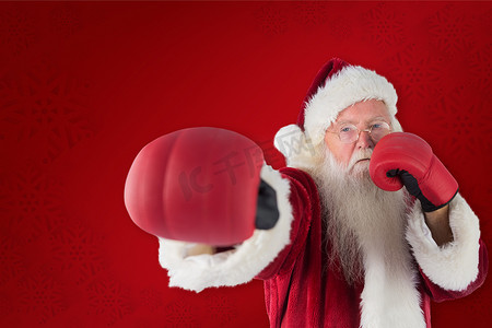 红拳摄影照片_圣诞老人用他的右拳的合成图像