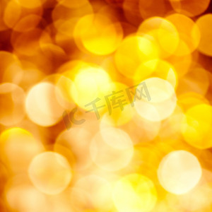 金色模糊摄影照片_抽象的金色模糊灯光背景
